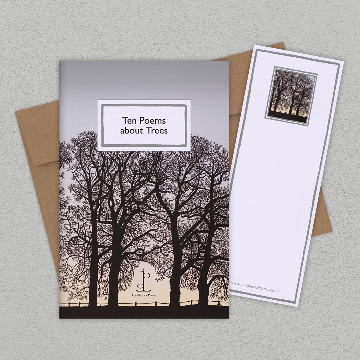 The Poem Pamphlet, 'Ten Poems about Trees' sits on a light grey background with the bookmark and brown envelope.