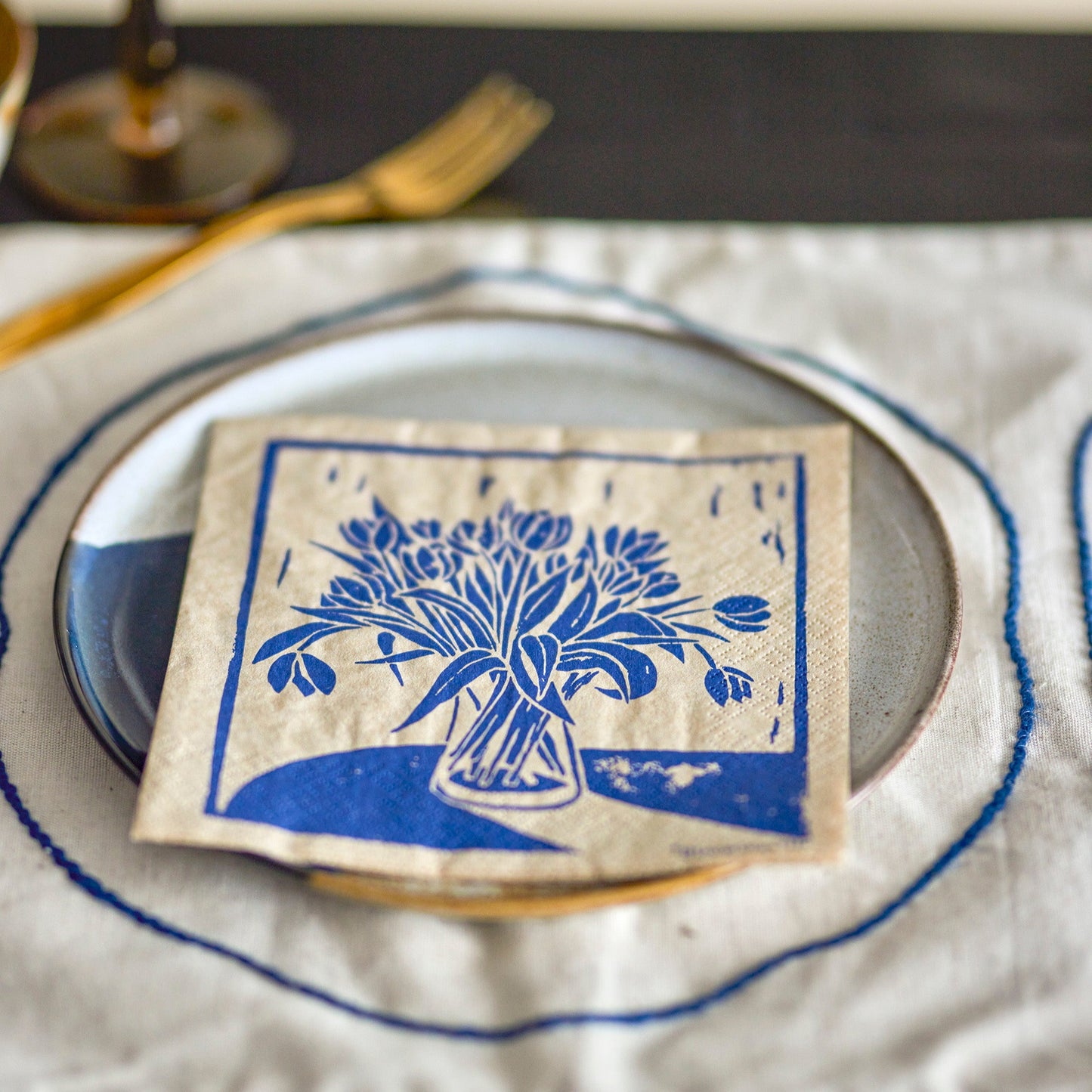 Blue tulip napkin on a plate