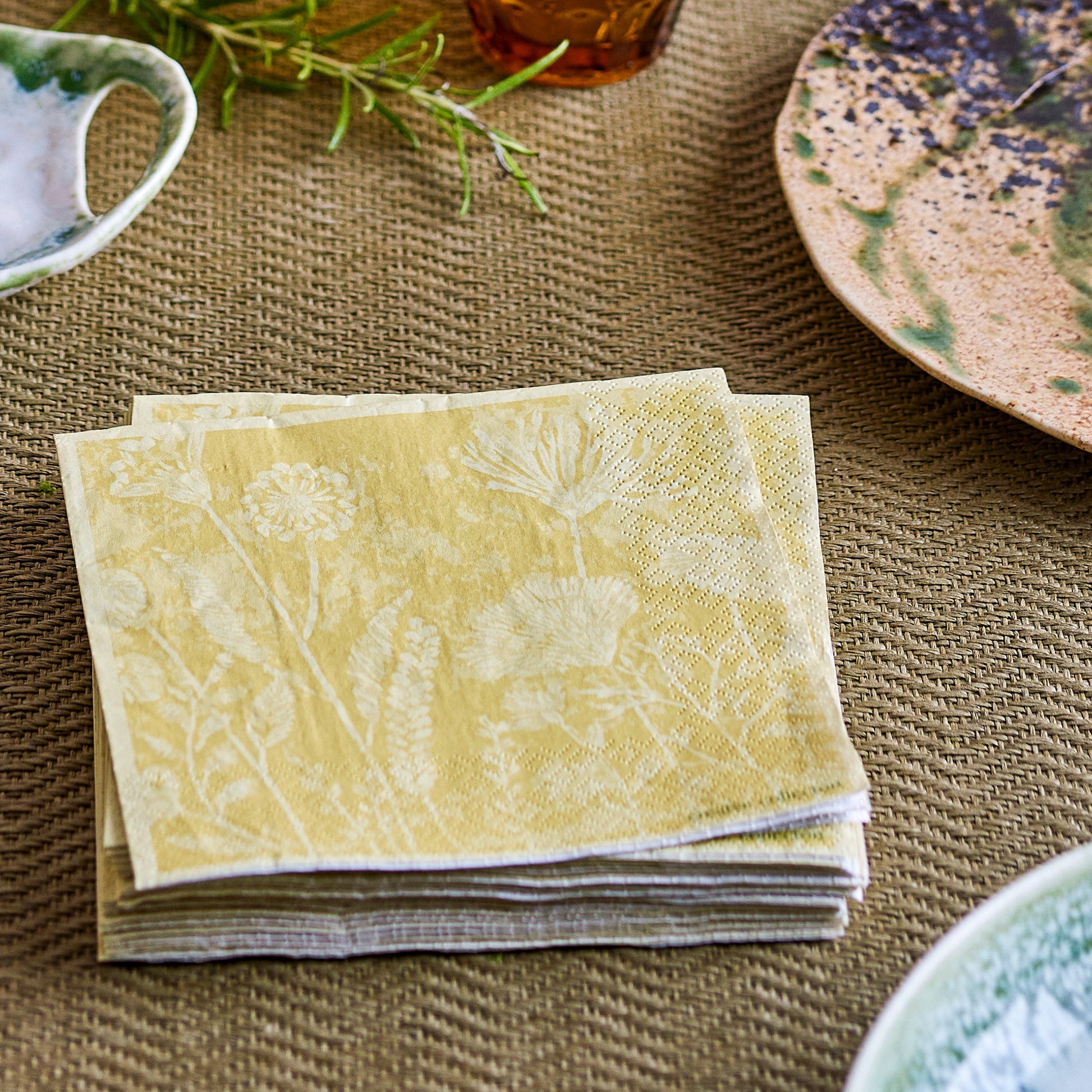 Stack of yellow napkins on table