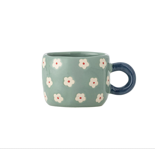 Blue mug with floral pattern on a white background