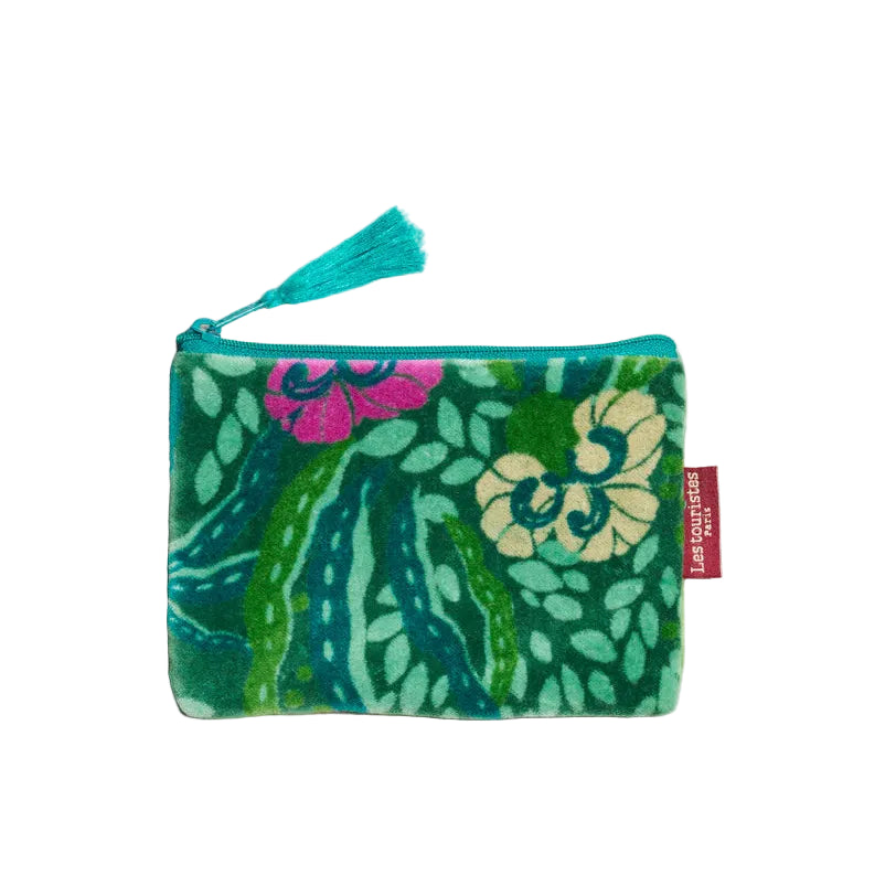 Green floral-patterned pouch with a tassel on a beige background