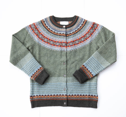 Green cardigan with patterned collar and cuffs on a white background