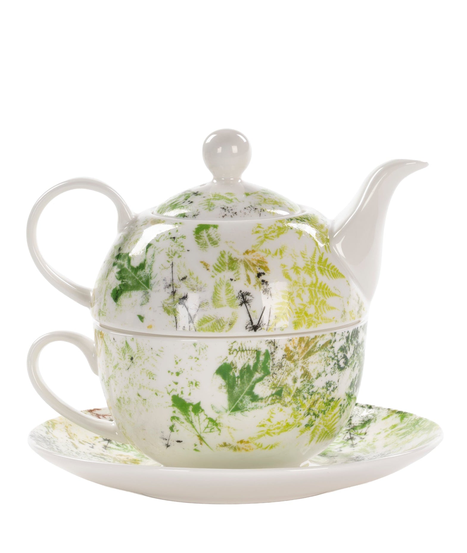 A white ceramic teapot and matching cup and saucer set decorated with a green botanical and bird pattern, shown on a plain white background.