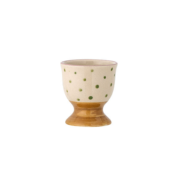 Green dotty egg cup with brown band at bottom.