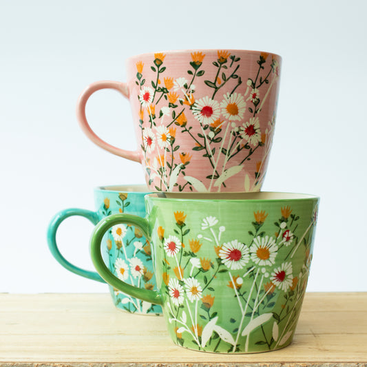 stack of three mugs - pink, green, blue